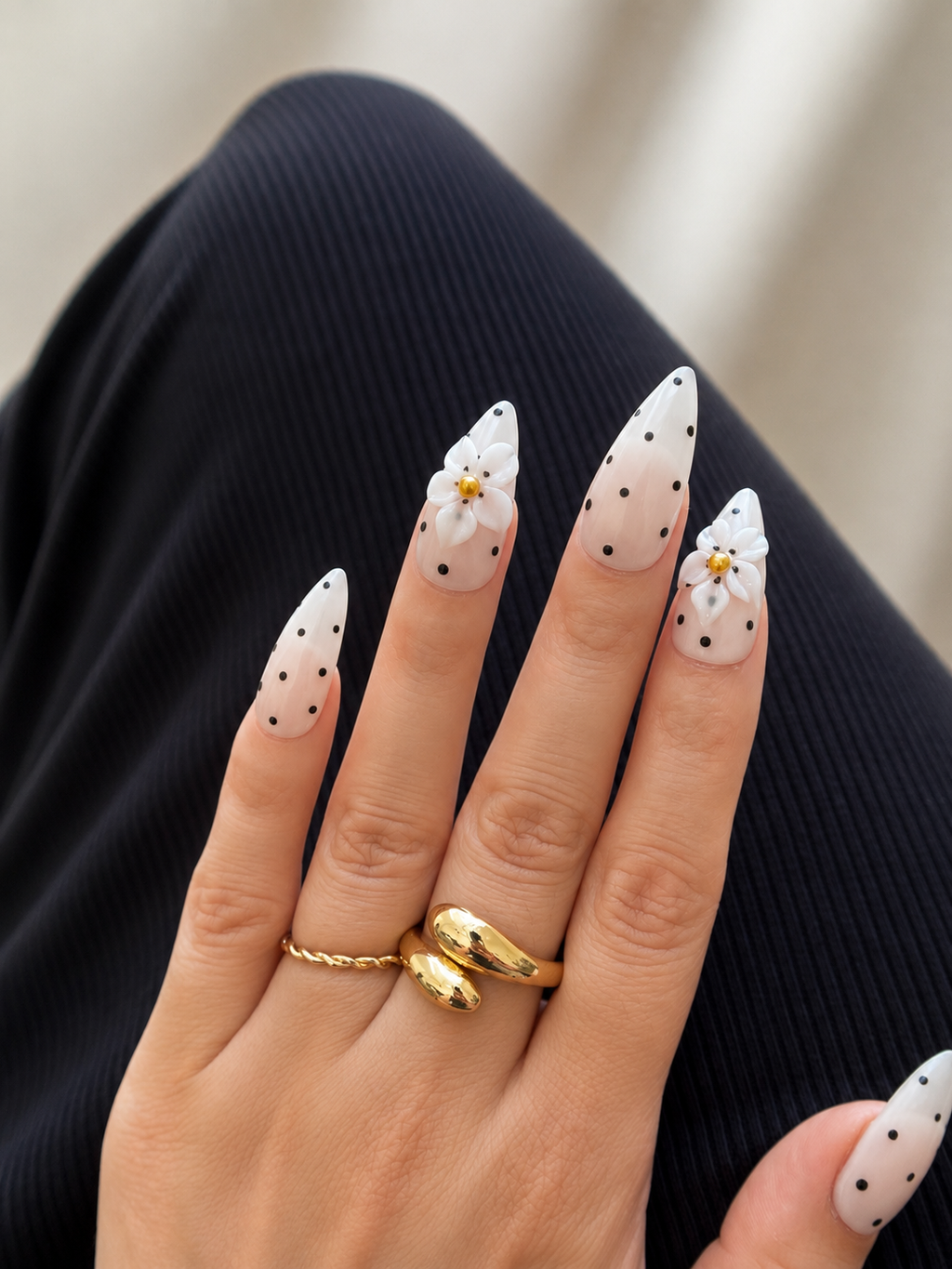  Daisy Noir luxury handmade gel press-on nails with black polka dots and 3D white flowers.