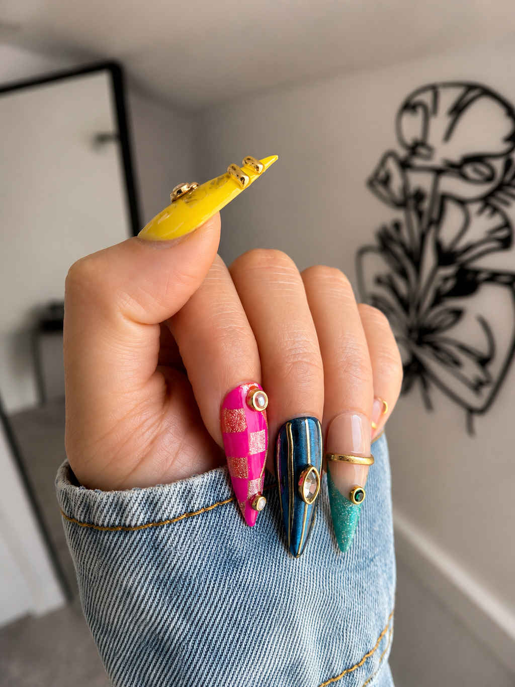 Close-up of handmade luxury press-on nails featuring premium gel, pearl embellishments, gold accents, and sparkling details.