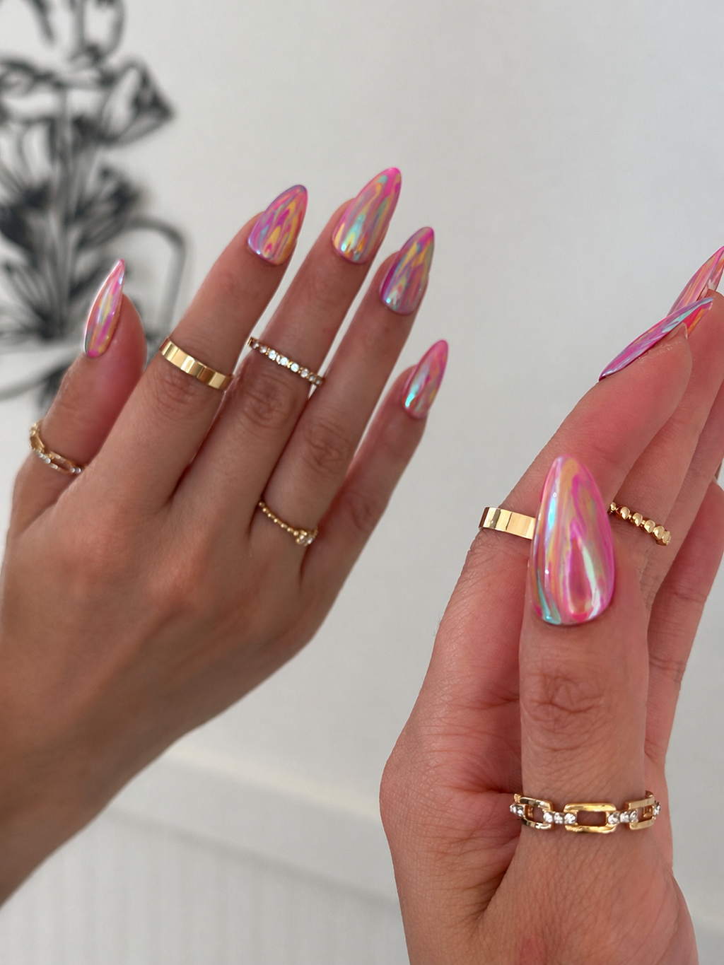 Prism Kiss press-on nails with pink tones and iridescent chrome finish