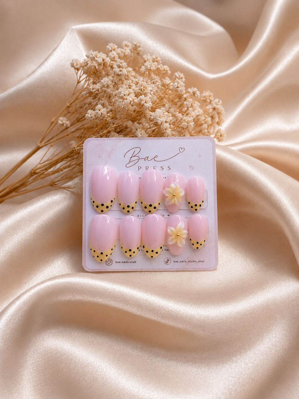 Buttercup Bloom press-on nails with pink base, yellow tips, and 3D floral accents