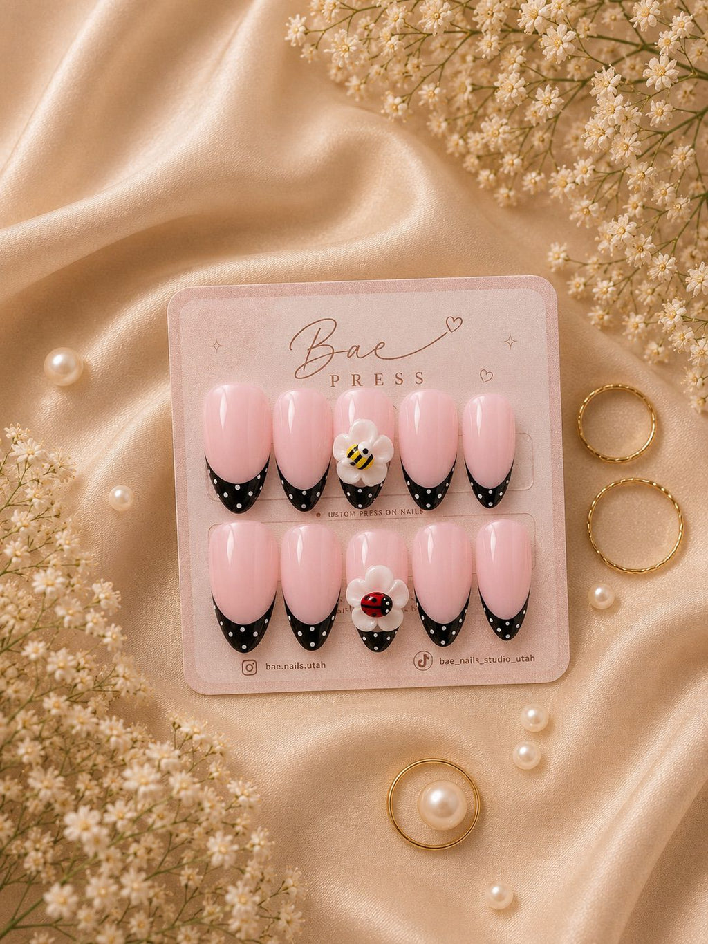 Garden Whimsy floral press-on nails with polka dot French tips and bee and ladybug details