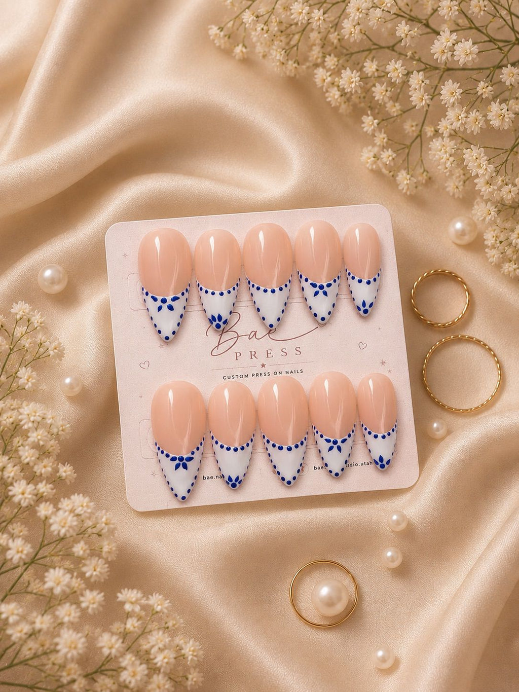 Blue Porcelain press-on nails with French tips and royal blue floral details